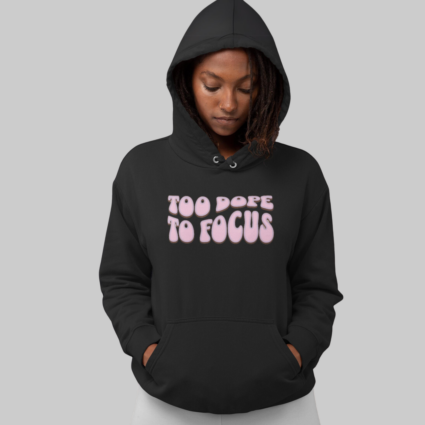 A smiling woman in a Too Dope To Focus Unisex Hooded Sweatshirt with the text "too dope to focus on mental health" printed on the front.